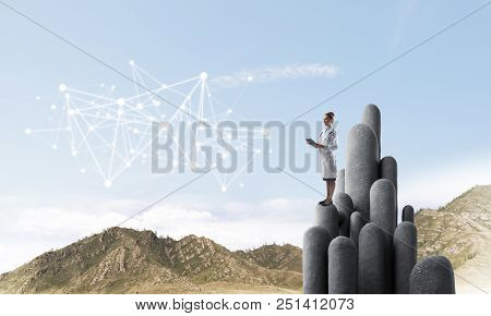 Young Female Doctor With Folder In Hands Satnding On Stone Column. 3d Rendering
