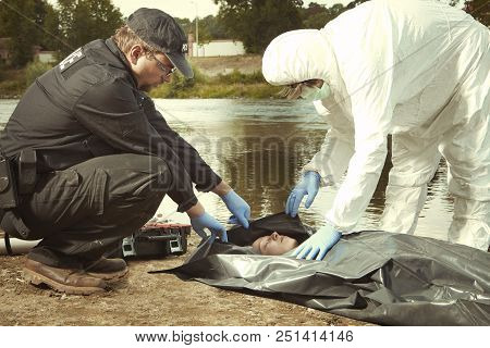 Woman Found Drowned On River Bank In City Placed In Body Bag For Transportration
