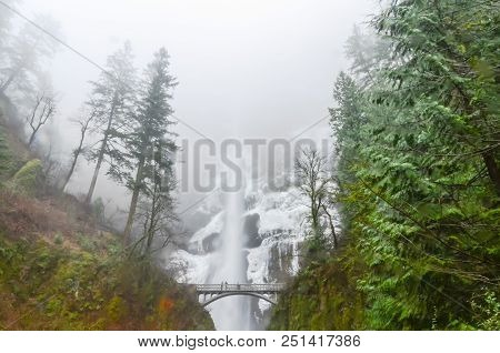 Close-up Bridge And Top Tier Full 542-foot Height Of Multnomah Falls In Winter Time. Natural And Sea