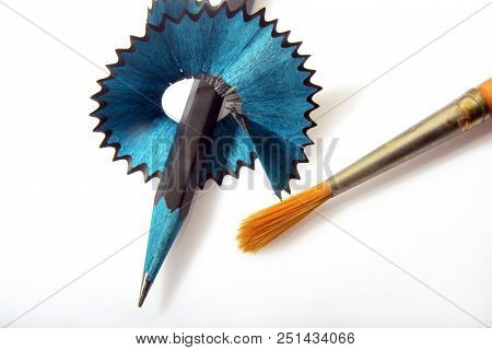 A Sharp Lead Pencil And Art Brush On White Background
