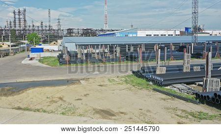 Warehouse Of Finished Plastic Pipes Industrial Outdoors Storage Site. Manufacture Of Plastic Water P
