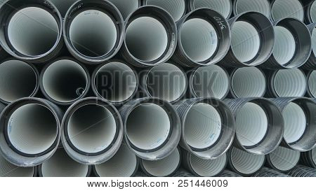 Warehouse Of Finished Plastic Pipes Industrial Outdoors Storage Site. Manufacture Of Plastic Water P