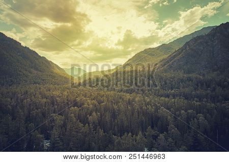 Siberian Mountain Taiga, Mountains In The Clouds, Altai. Beautiful Gloomy Atmospheric Landscape With