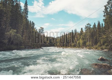 The Fast Flowing Crystal Clear Waters Of The River During Early Spring Run. Mountain River Flows In 