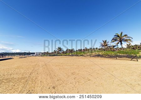Empty Beach With Tire Tracks Against Blue Sky At Addinton Beach In Durban, South Africa