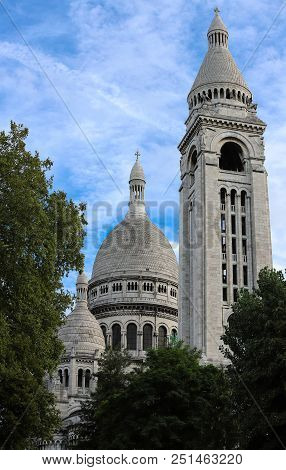 The Basilica Sacre Coeur Is A Roman Catholic Church Located At The Summet Of The Butte Montmartre , 