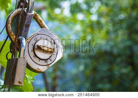 Old And Rusty Combination Locks Attached To Locks. Security Concept