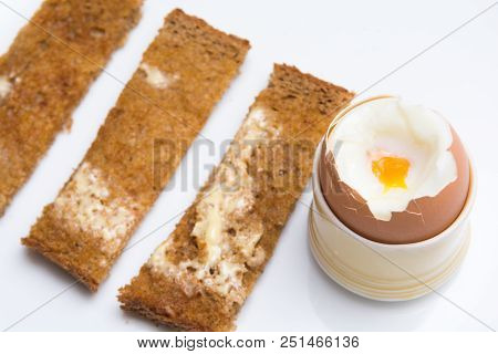 Soft Boiled Eggs With Toast On A White Plate. Breakfast