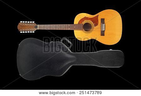Musical Instrument - Vintage Twelve-string Acoustic Guitar Hard Case Isolated On A Black Background.
