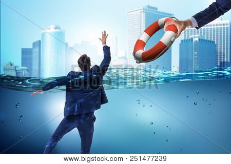 Businessman being saved from drowning