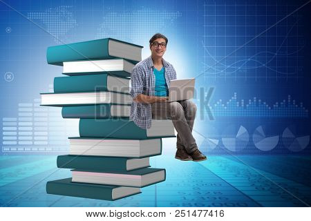 Young man in telelearning concept with laptop and books