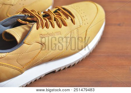 Kiev, Ukraine - May 30, 2018: Reebok Photo Of Brown Sneakers On The White Soles Behind