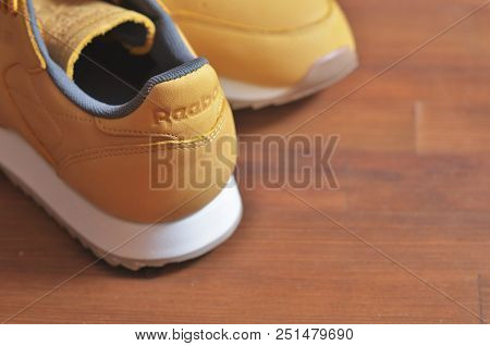 Kiev, Ukraine - May 30, 2018: Reebok Photo Of The Back Of A Brown Sneaker On A Wooden Background