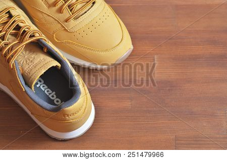 Kiev, Ukraine - May 30, 2018: Reebok Photo Of A Brown Sneaker On Top Of A Wooden Background
