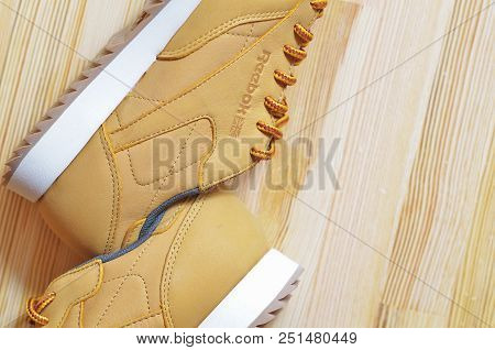 Kiev, Ukraine - May 30, 2018: Reebok Sneakers Lie Side By Side On A Light Wooden Background