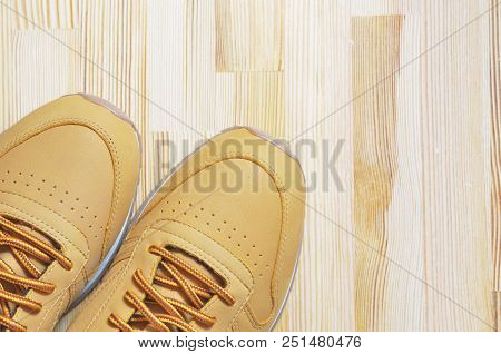 Kiev, Ukraine - May 30, 2018: Reebok Orange Sneakers On A Light Wooden Background