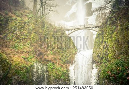 Vintage Tone Icy Lower Tier Multnomah Falls Oregon In Wintertime