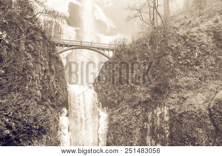 Vintage Tone Icy Lower Tier Multnomah Falls Oregon In Wintertime