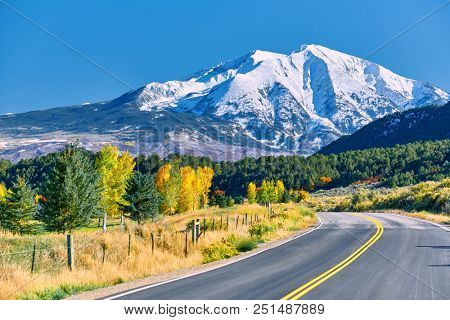 Highway in Colorado at autumn, USA. Mount Sopris landscape.