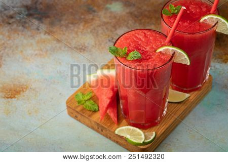 Watermelon Slushie With Lime, Summer Refreshing Drink In Tall Glasses On A Blue Rusty Background. Wi