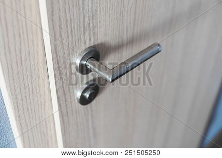 Door Handle And Inner Lock On A Wooden Doors