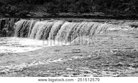 Small Waterfall On Tosna River In Leningrad Region, Russia. Black And White.