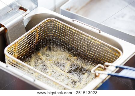Preparing French Potato In Kitchen Of Cafe Or Restaurant