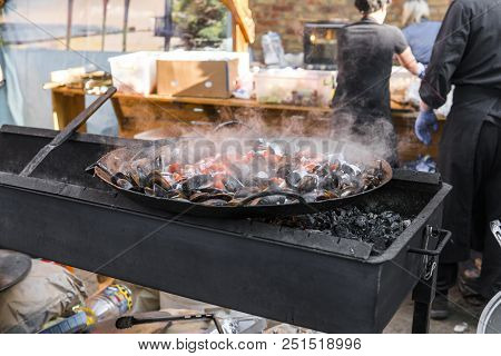 Fresh Mussels At Grill Pan. Seafood Barbecue Outdoors. Picnic Healthy Food, Mussels In Shells. Plent