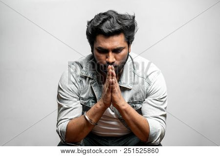 Man Hoping For The Best. Sadness, Sorrow Concept. Upset Man In Praying Pose