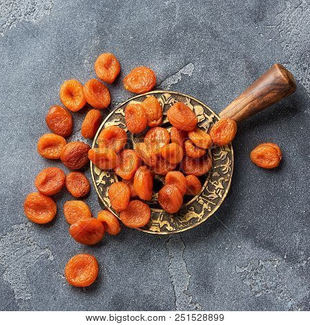 Dried Apricots On Gray Background. Top View.