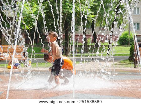 Gomel, Belarus Children Bathing In The Fountain. Square Named After Gromyko