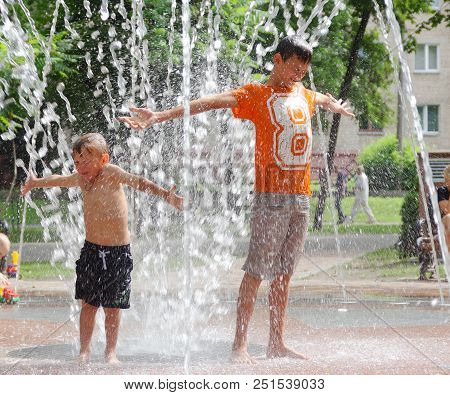 Gomel, Belarus Children Bathing In The Fountain. Square Named After Gromyko