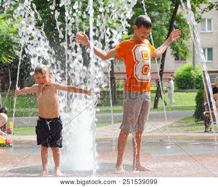 Gomel, Belarus Children Bathing In The Fountain. Square Named After Gromyko