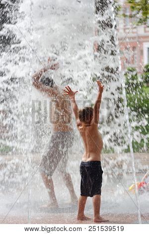 Gomel, Belarus Children Bathing In The Fountain. Square Named After Gromyko