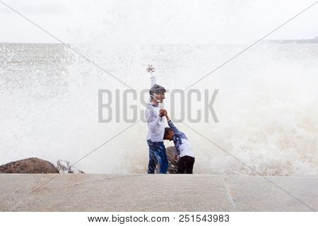 MUMBAI, INDIA - JULY 2 2018: Unidentified people visit promenade in South Mumbai. 
The promenade is an open space where people could meet friends and just spend time