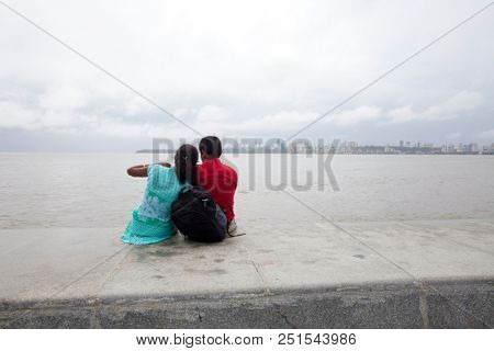 MUMBAI, INDIA - JULY 2 2018: Unidentified people visit promenade in South Mumbai. 
The promenade is an open space where people could meet friends and just spend time