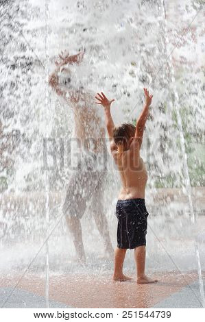 Gomel, Belarus Children Bathing In The Fountain. Square Named After Gromyko