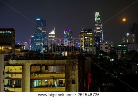 Ho Chi Minh City, Vietnam - January 2nd 2018. A Full Moon And The Saigon Skyline Looking Towards The