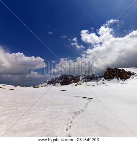 Snowy Plateau With Footpath At Sunlight Cloudy Sky. Turkey, Central Taurus Mountains, Aladaglar (ant