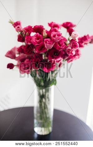 A Large Bouquet Of Eustoms On The Table.