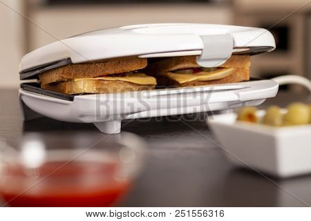 Detail Of Hot Sandwiches Being Prepared In A Sandwich Maker. Selective Focus On The Sandwiches
