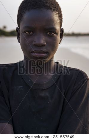Orango Island, Guinea-bissau - February 2, 2018:  Portrait Of A Young African Boy At The Beach In Th