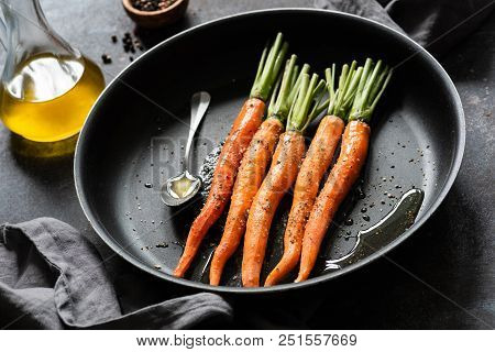 Cooking Carrots. Fresh Carrots Ready For Cooking On A Pan. Roast Carrots With Olive Oil And Honey
