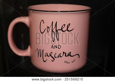 A Pink Coffee Drinking Cup With Mocha