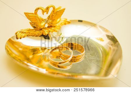 Wedding Symbols Two Rings On Golden Heart-shaped Tray - Love, Family, Celebration, Ceremony Concept