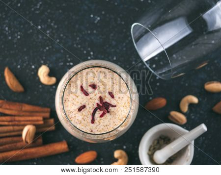 Thandai Or Sardai Cold Drink Made During Holi Festival. Cold Milk Drink In Glass, With Ingredients -