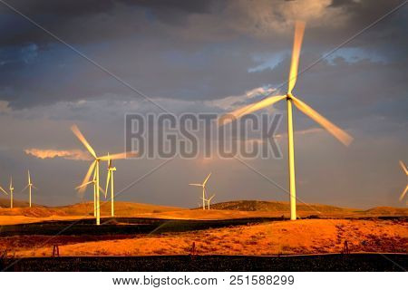 Power generated by wind with winmill blowing sky clouds sunset sunrise