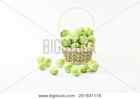 Small Hand Basket Full With Green Fresh Raw Brussel Sprout Cabbage From Garden Nature, Organic Veget