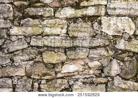 A Close-up Of Ancient, Giant, Tame Stone Blocks In A Solid, Weathered Stone Foundation.