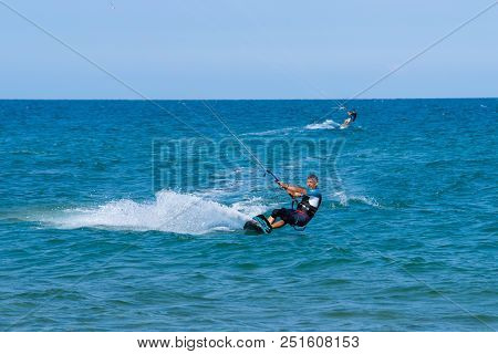 Shkorpilovtsi, Bulgaria - June 29, 2018: Kiteboarder Athlete Performing Kiteboarding Tricks On The W